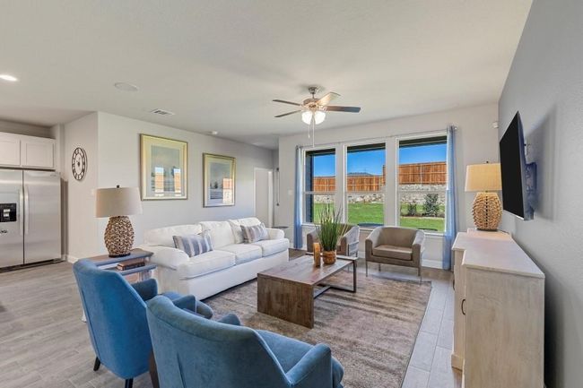 Living room featuring ceiling fan, light wood-style flooring, and recessed lighting | Image 12