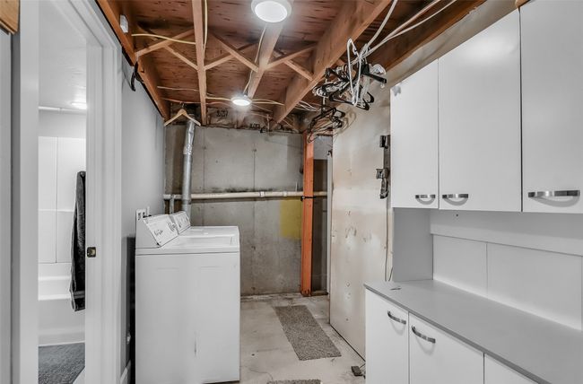 Unfinished below grade area featuring washing machine and dryer | Image 25