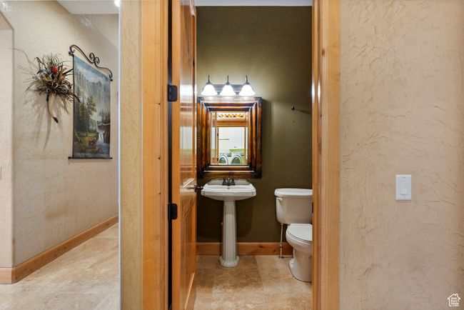 Half bathroom just off mudroom/garage | Image 44