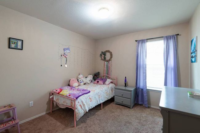 Bedroom featuring carpet and baseboards | Image 23