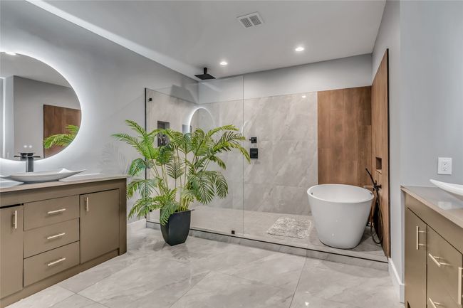 Bathroom with vanity, marble finish flooring, walk in shower, a soaking tub, and recessed lighting | Image 21