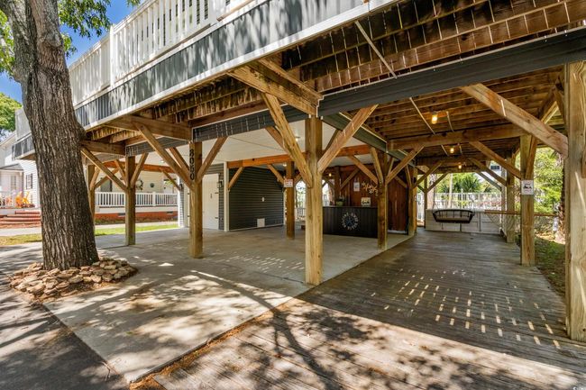 View of property's community featuring a carport | Image 4