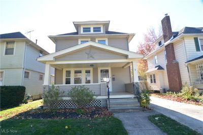 View of front of home with a porch and central AC unit | Image 1