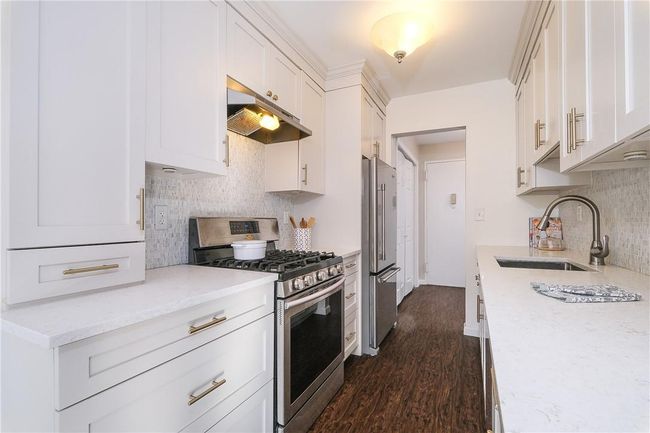 Close-up of wonderfully updated kitchen. | Image 15