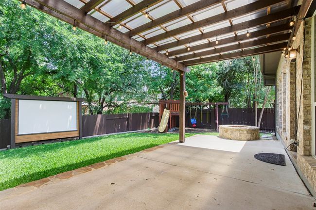 View of patio / terrace with a playground, an outdoor fire pit, and a pergola | Image 35