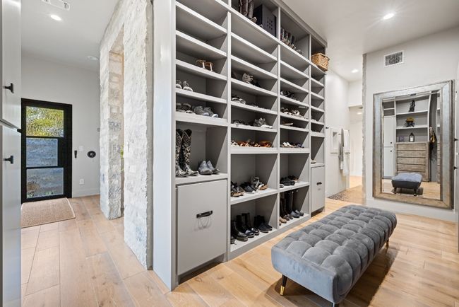 Spacious closet featuring wood finished floors. Secondary closet not shown. | Image 28