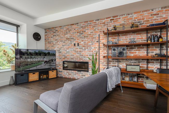 Living room with hardwood / wood-style flooring and a brick fireplace | Image 7