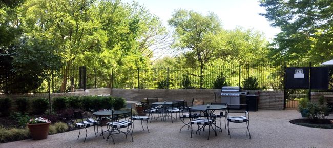 View of patio / terrace featuring, heated pool, outdoor dining space and surrounded by trees! | Image 26
