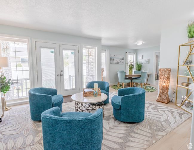 Living area featuring french doors, healthy amount of natural light, and a textured ceiling | Image 20
