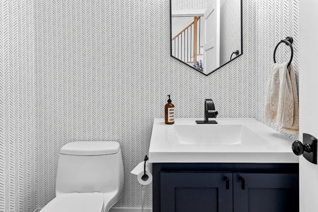 Half bath featuring vanity and wallpapered walls | Image 21