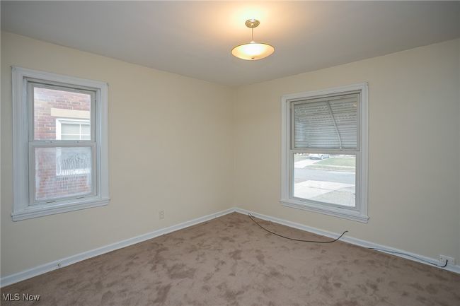 Carpeted empty room with baseboards | Image 11