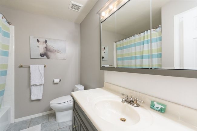 Bathroom featuring vanity and tile patterned flooring | Image 21