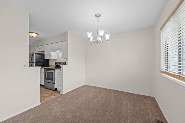 Dining room opens to kitchen | Image 7