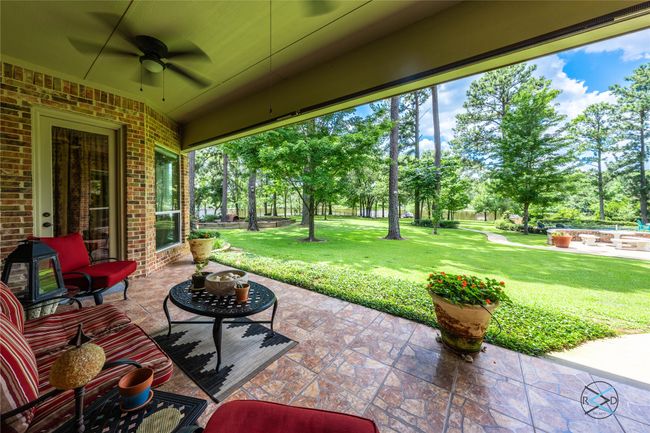 View of patio / terrace featuring ceiling fan | Image 11