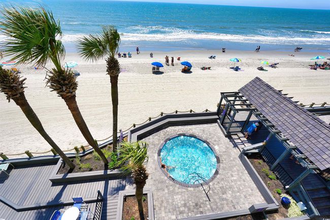 View of pool featuring view of water and beach | Image 37