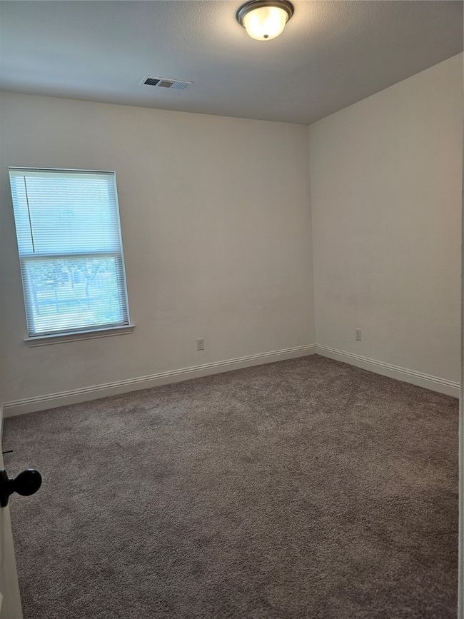 Carpeted spare room featuring baseboards | Image 15
