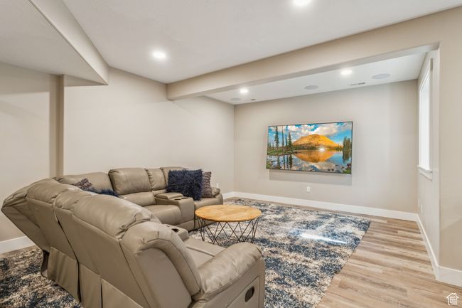 Living area featuring wood finished floors and recessed lighting | Image 53
