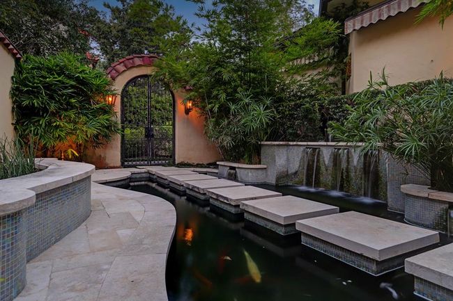 Koi Pond on the SE side of the home is very peaceful and has waterfall fountain, pumps, chiller and seating area. Both entrances are gated. | Image 46