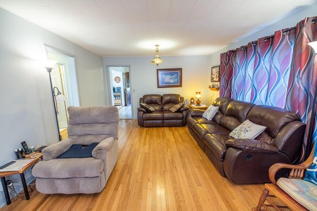 Living room featuring light hardwood / wood-style flooring | Image 10