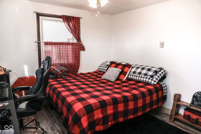 bedroom featuring wood finished floors | Image 16