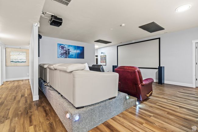 Cinema featuring hardwood / wood-style floors | Image 63