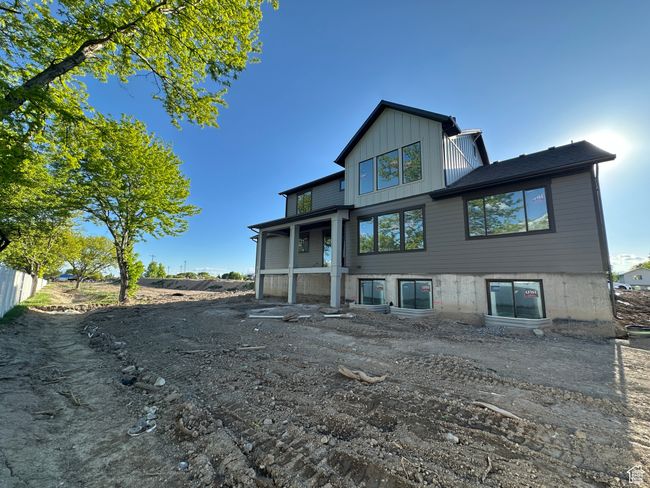 Rear view of property with board and batten siding | Image 39