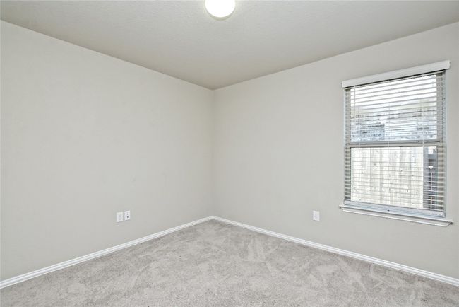 Carpeted spare room featuring a healthy amount of sunlight and baseboards | Image 20