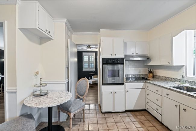 Opening above sink into den | Image 14