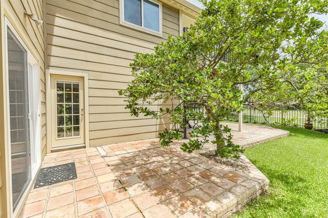 Sliding Breakfast Room and Dining Room doors lead out to this cozy side patio | Image 42