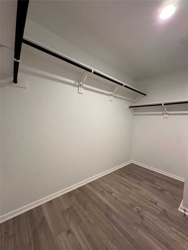 Spacious closet featuring wood finished floors | Image 23