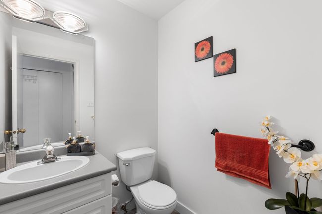Bathroom featuring vanity and toilet | Image 17