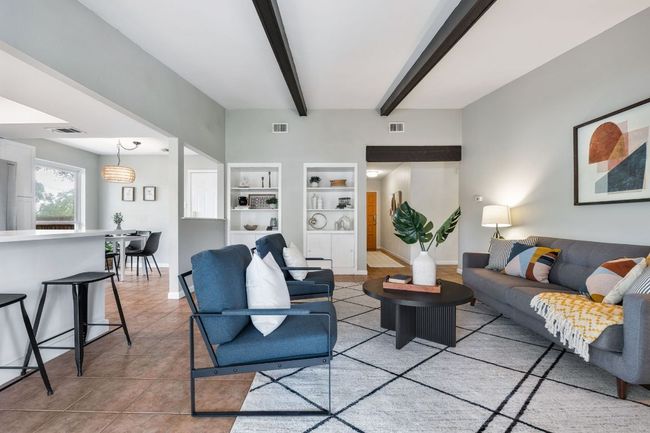 Living room has built in storage and shelving | Image 7