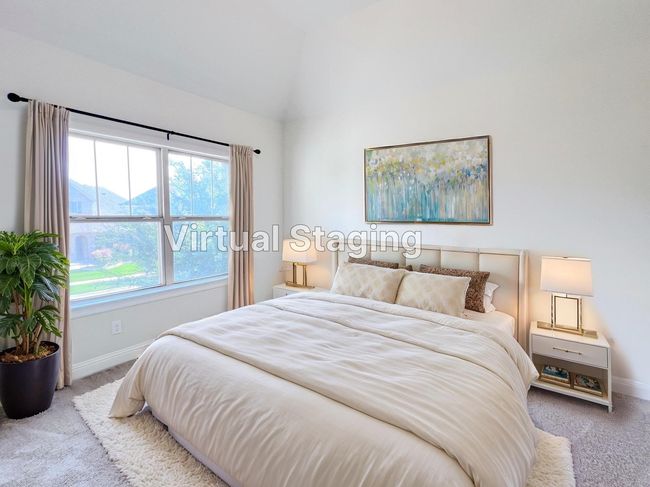 Carpeted bedroom featuring baseboards and high vaulted ceiling | Image 28