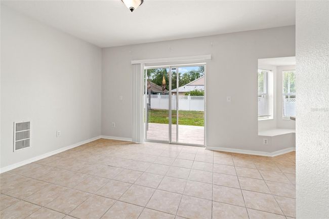 Dining Area and access to fenced in backyard | Image 19