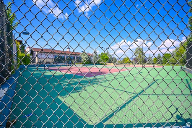 View of tennis court featuring fence | Image 39