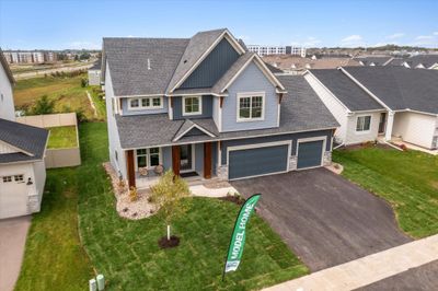 The Deacon - gorgeous exterior including front porch with huge, stained pillars, architectural shingles and 3 car garage | Image 2