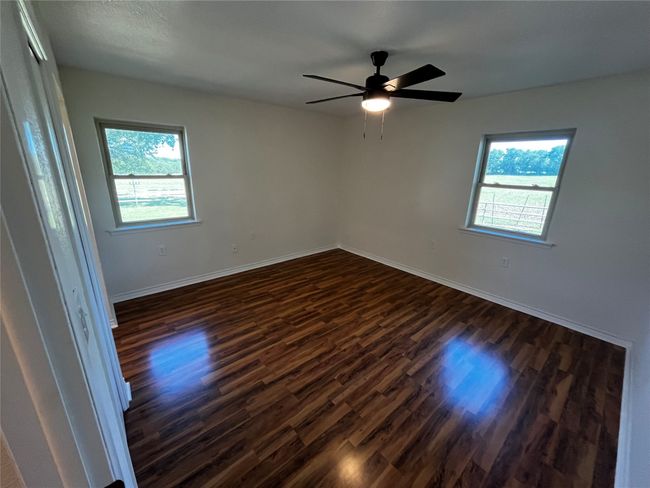 If you need a place to escape at the end of the day, look no further! This primary suite has lovely natural light and scenic views. | Image 19