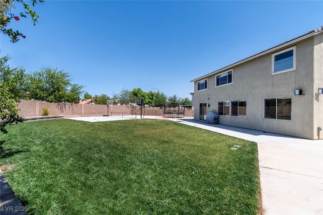 View of yard with a patio and fence | Image 41