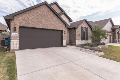 Front garage entry with room for parking in garage and driveway | Image 2