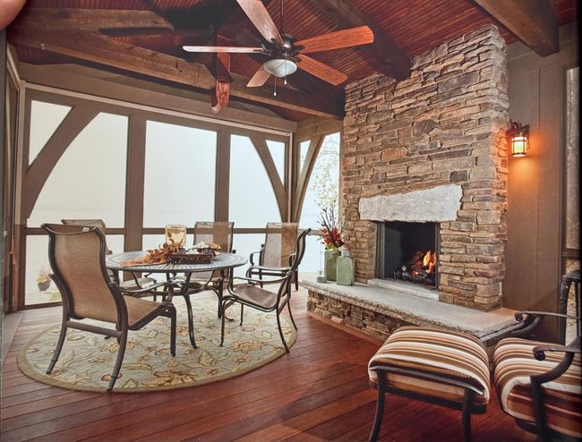 Having over the lake, the three season porch has impressive craftsmanship and amazing view. | Image 5