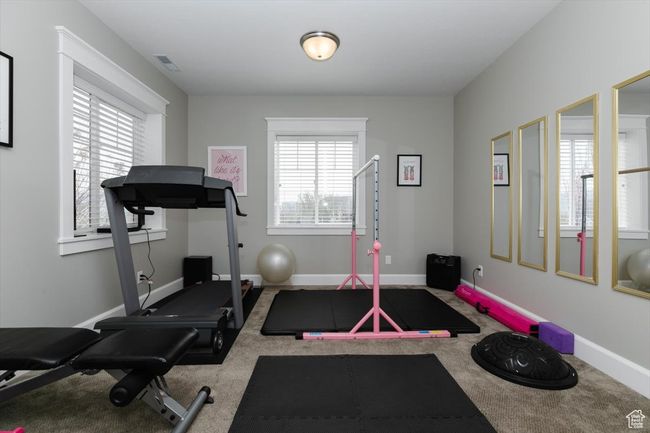 Workout room with baseboards, carpet flooring, and visible vents | Image 55