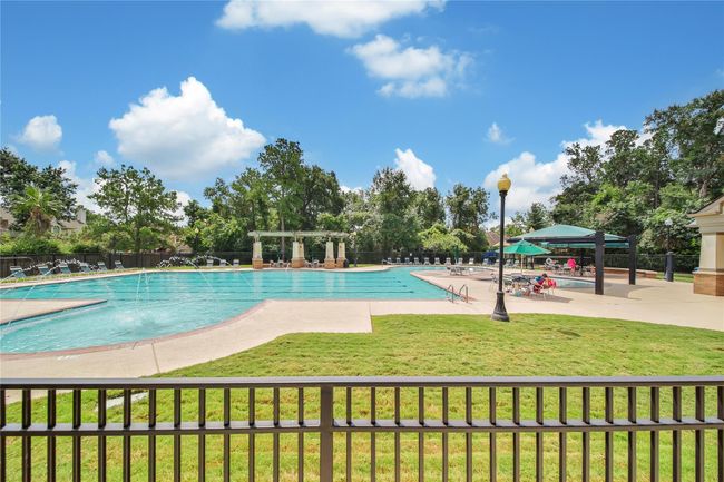 There is plenty of lounge space around the pool for everyone to enjoy. | Image 37
