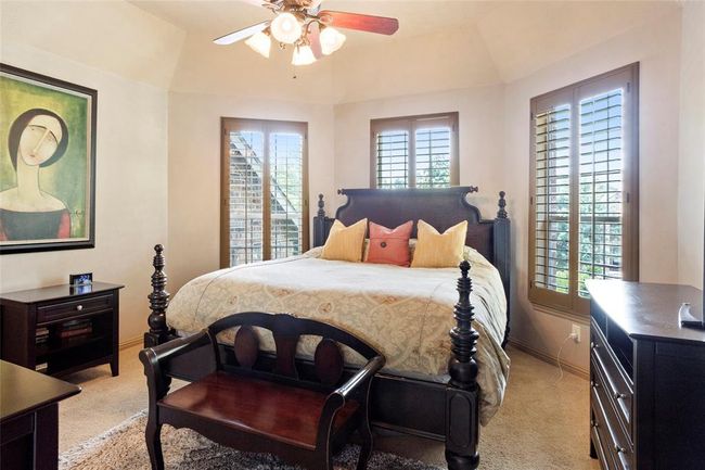 Another secondary bedroom upstairs with walk in closet, upstairs has a split plan. | Image 26
