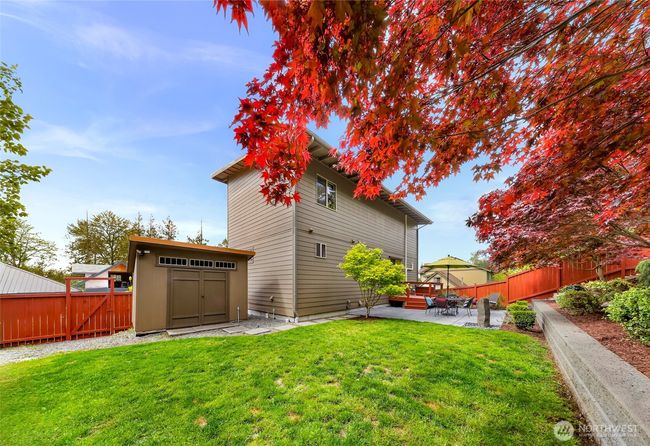 The backyard is fully fenced in, with an entrance/exit off the side onto the road. Complete with a large garden shed wired with power. | Image 31
