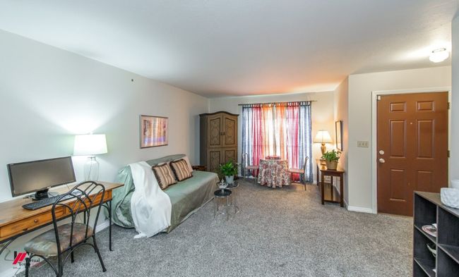 Carpeted living room with baseboards | Image 5