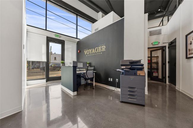 Office featuring baseboards, visible vents, and a towering ceiling | Image 7