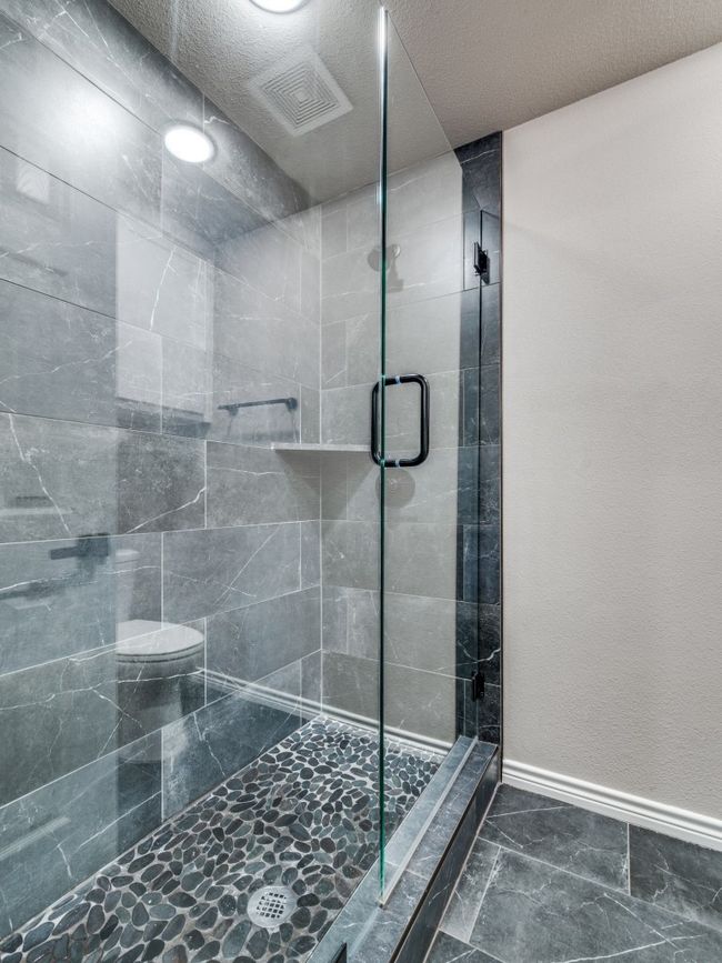 Full bath with a stall shower, baseboards, marble finish floors, and toilet | Image 20
