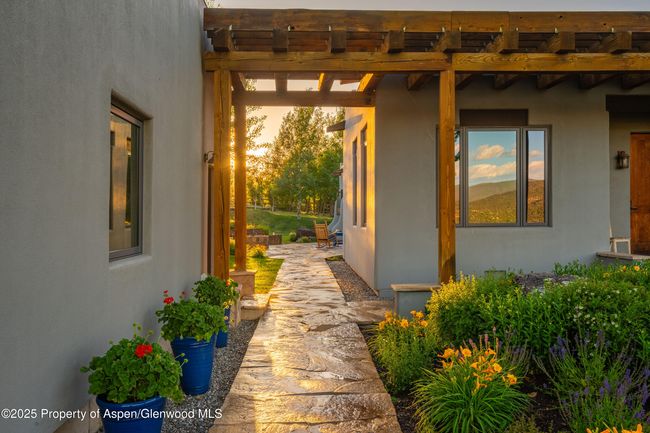 The entry is surrounded in large flagstone patios and paths. | Image 4