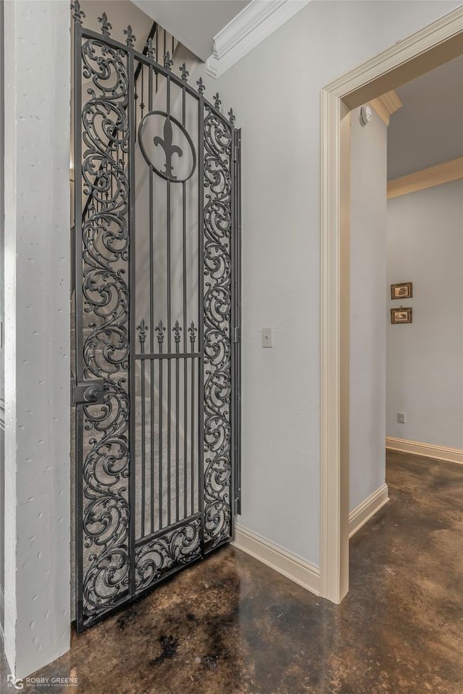 Gorgeous iron gate to upstairs bedrooms and bonus room. | Image 18