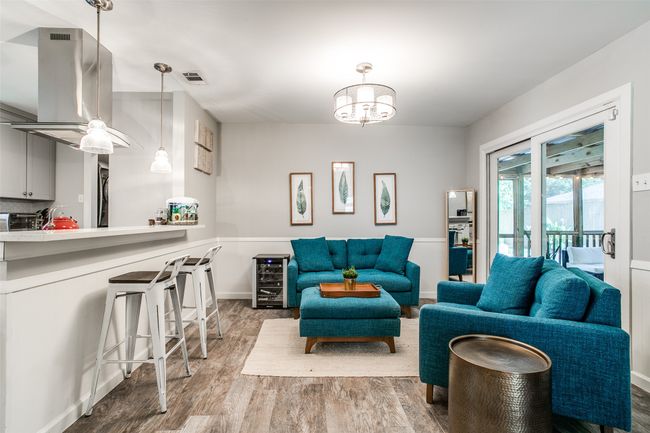 Living area with wood finished floors | Image 9